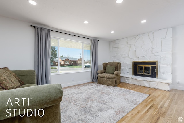 379 E 100 S, Kaysville, UT 84037 - living area with baseboards, recessed lighting, wood finished floors, and a stone fireplace