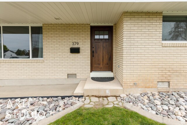379 E 100 S, Kaysville, UT 84037 - property entrance featuring crawl space and brick siding