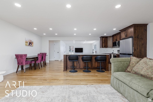 379 E 100 S, Kaysville, UT 84037 - living room featuring recessed lighting, baseboards, and light wood-type flooring