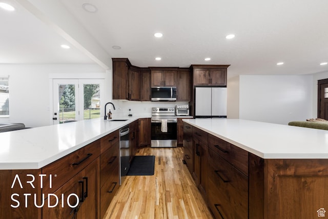 379 E 100 S, Kaysville, UT 84037 - kitchen with light wood-style flooring, recessed lighting, a sink, and appliances with stainless steel finishes