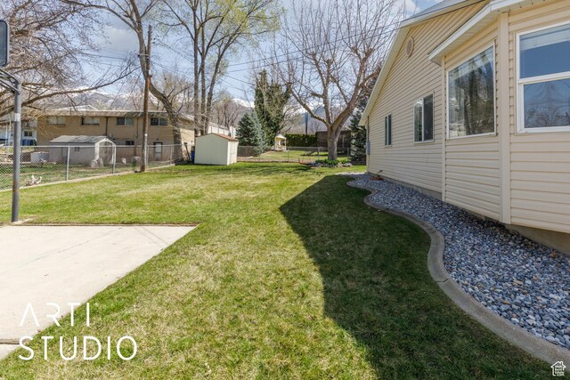379 E 100 S, Kaysville, UT 84037 - view of yard with an outdoor structure, a shed, and fence