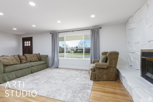 379 E 100 S, Kaysville, UT 84037 - living room featuring baseboards, recessed lighting, a large fireplace, and light wood finished floors
