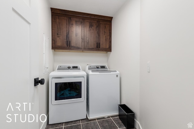 379 E 100 S, Kaysville, UT 84037 - clothes washing area featuring dark tile patterned floors, washer and clothes dryer, cabinet space, and baseboards