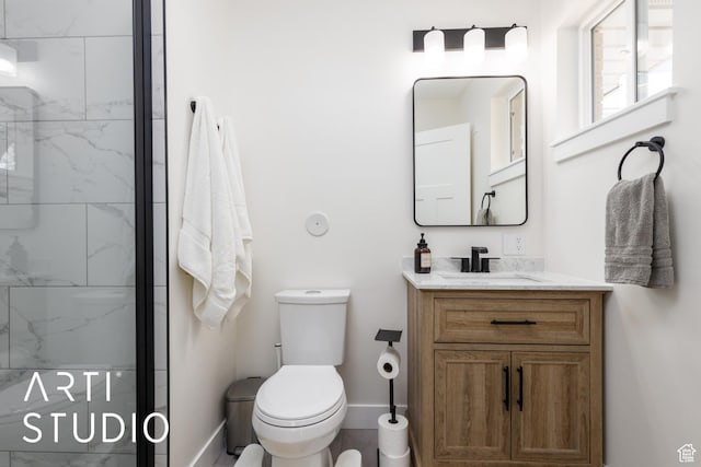 379 E 100 S, Kaysville, UT 84037 - bathroom featuring baseboards, a marble finish shower, toilet, and vanity