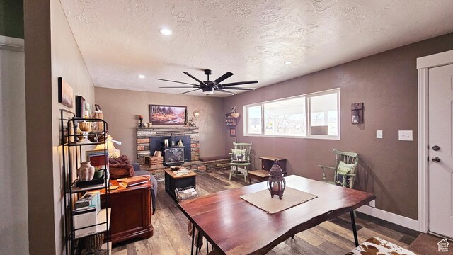 1018 N 3500 W, Vernal, UT 84078 - dining room with a wood stove, a textured ceiling, a ceiling fan, recessed lighting, and wood finished floors