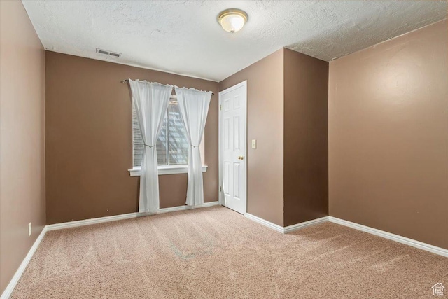 14883 S 3200 W, Bluffdale, UT 84065 - spare room with carpet, visible vents, a textured ceiling, and baseboards