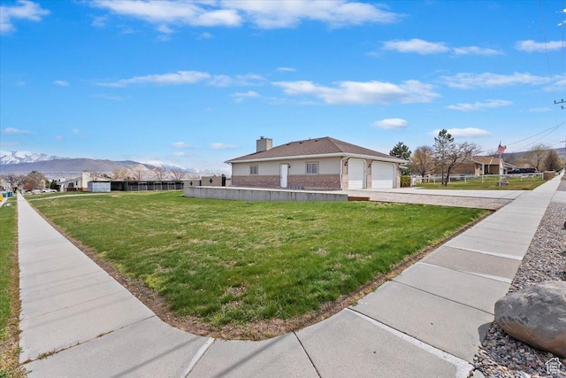 14883 S 3200 W, Bluffdale, UT 84065 - view of side of home with a garage, a yard, driveway, and a mountain view