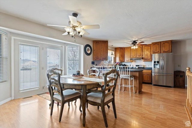 14883 S 3200 W, Bluffdale, UT 84065 - dining room with visible vents, ceiling fan, and light wood finished floors