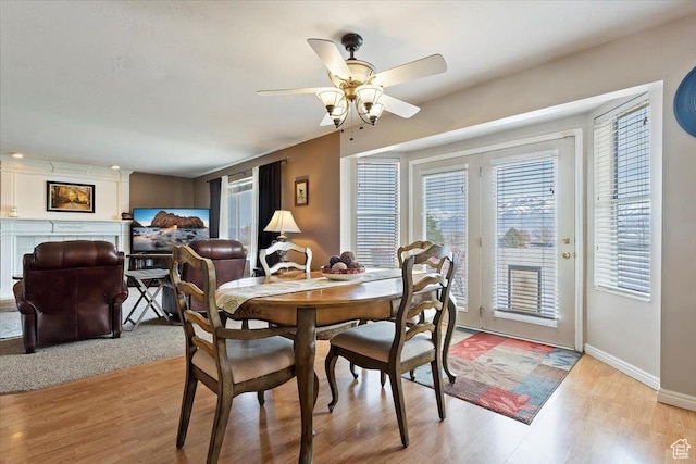 14883 S 3200 W, Bluffdale, UT 84065 - dining area with light wood-style flooring, baseboards, and ceiling fan