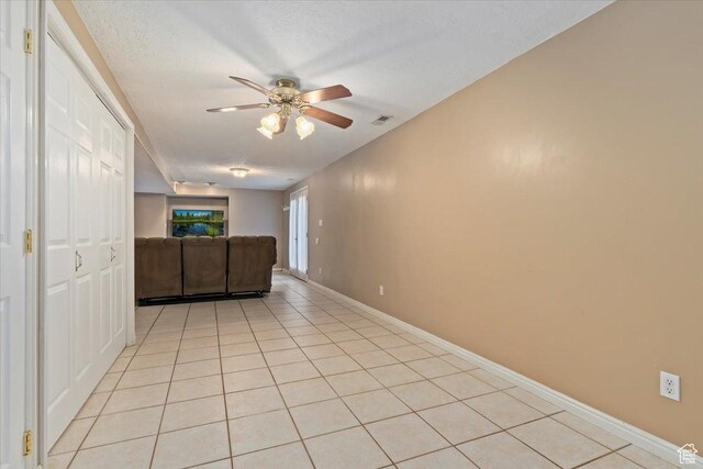 14883 S 3200 W, Bluffdale, UT 84065 - interior space featuring visible vents, baseboards, light tile patterned flooring, and ceiling fan