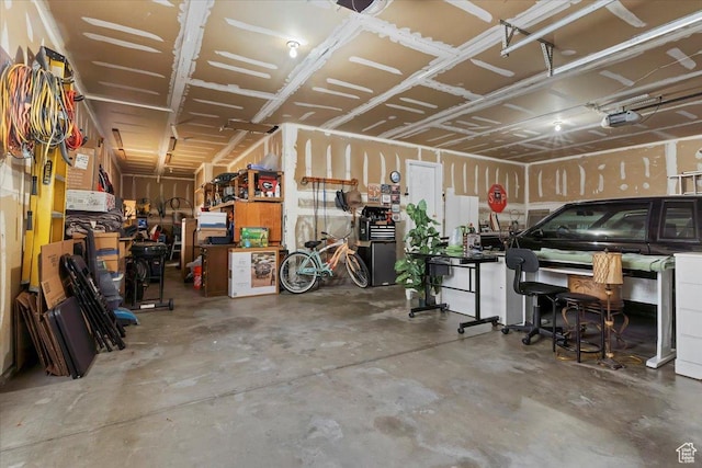 14883 S 3200 W, Bluffdale, UT 84065 - garage featuring a workshop area and a garage door opener