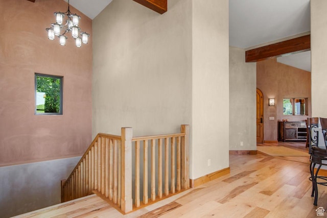 10129 N Basin Canyon Rd, Park City, UT 84098 - interior space with high vaulted ceiling, beamed ceiling, a chandelier, wood finished floors, and baseboards