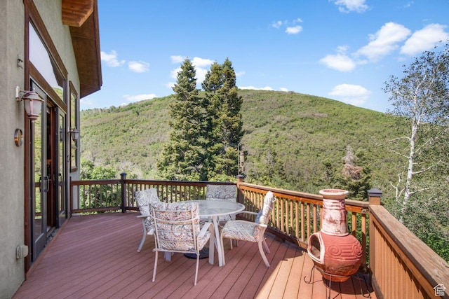 10129 N Basin Canyon Rd, Park City, UT 84098 - wooden deck featuring a view of trees and outdoor dining area