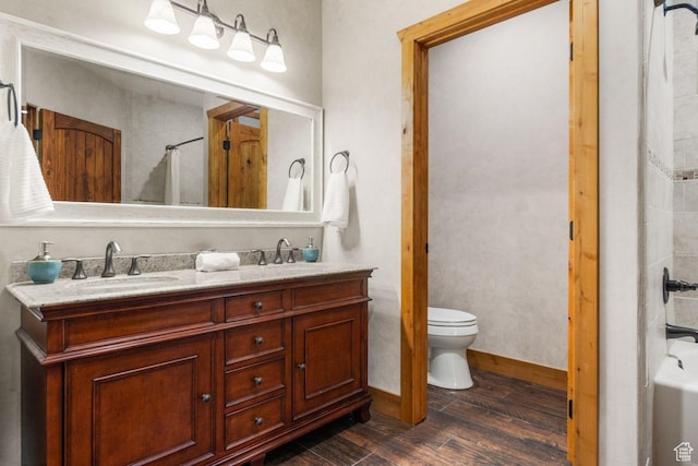 10129 N Basin Canyon Rd, Park City, UT 84098 - full bath with double vanity, a bathtub, toilet, a sink, and wood finished floors