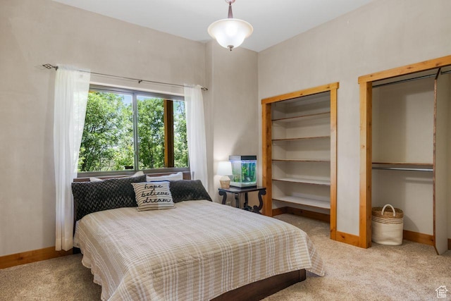 10129 N Basin Canyon Rd, Park City, UT 84098 - bedroom with multiple closets, light carpet, and baseboards