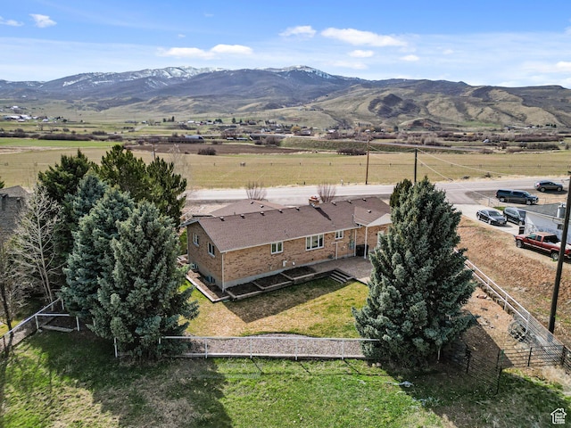 drone / aerial view featuring a mountain view