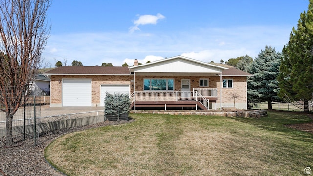 single story home featuring brick siding, a front lawn, fence, and driveway