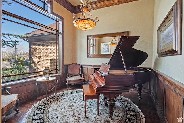 13879 S Standing Oak Dr E, Draper, UT 84020 - sitting room featuring crown molding, a decorative wall, dark wood finished floors, a wainscoted wall, and a chandelier