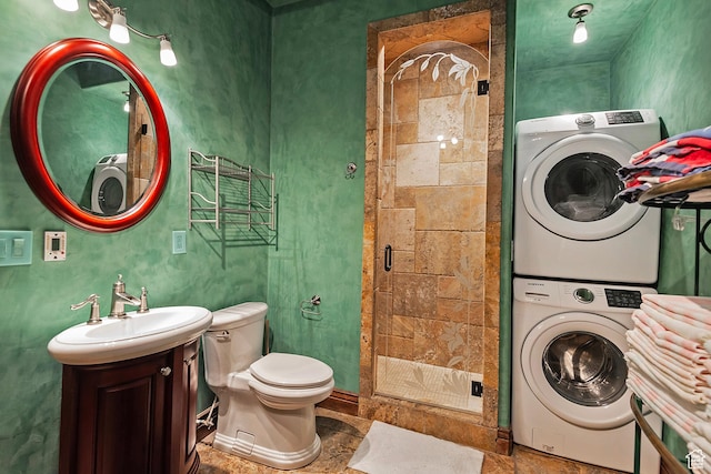 13879 S Standing Oak Dr E, Draper, UT 84020 - bathroom with toilet, stacked washer / dryer, a stall shower, and vanity