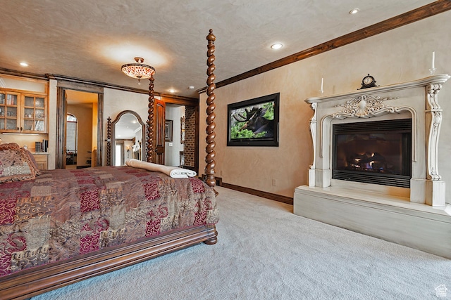 13879 S Standing Oak Dr E, Draper, UT 84020 - carpeted bedroom with ornamental molding, baseboards, and a glass covered fireplace