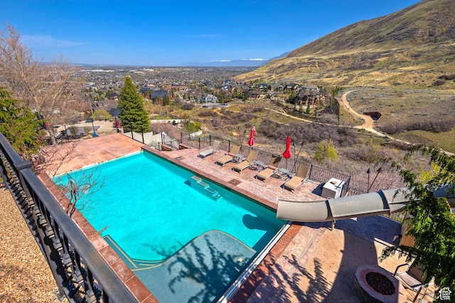 13879 S Standing Oak Dr E, Draper, UT 84020 - pool with a patio, a mountain view, and fence