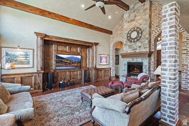13879 S Standing Oak Dr E, Draper, UT 84020 - living room featuring beam ceiling, a ceiling fan, a glass covered fireplace, and hardwood / wood-style flooring