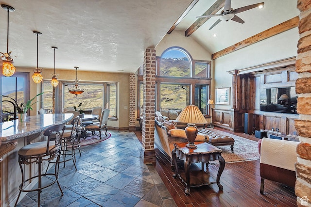 13879 S Standing Oak Dr E, Draper, UT 84020 - living area featuring a wealth of natural light, vaulted ceiling with beams, and ceiling fan