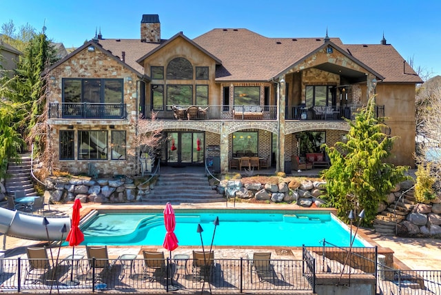 13879 S Standing Oak Dr E, Draper, UT 84020 - rear view of house with french doors, a patio area, fence, and a balcony