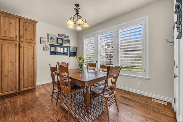 888 W 2800 N, Pleasant Grove, UT 84062 - dining space featuring a notable chandelier, visible vents, dark wood-style flooring, and baseboards