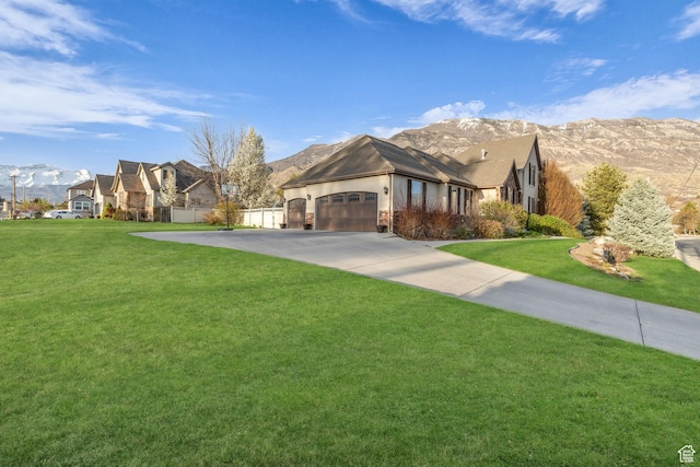 888 W 2800 N, Pleasant Grove, UT 84062 - view of front of home featuring an attached garage, driveway, fence, and a front lawn