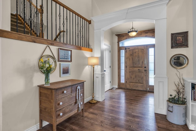 888 W 2800 N, Pleasant Grove, UT 84062 - entryway featuring baseboards, arched walkways, wood finished floors, and stairs