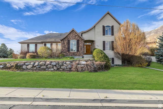 888 W 2800 N, Pleasant Grove, UT 84062 - view of front of home featuring a front yard, stone siding, and stucco siding