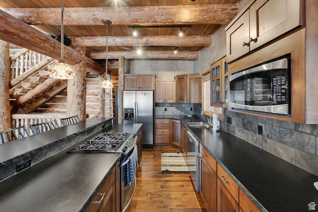4100 Buck Way Unit 1947, Heber City, UT 84032 - kitchen featuring dark countertops, beam ceiling, dark wood finished floors, stainless steel appliances, and wooden ceiling