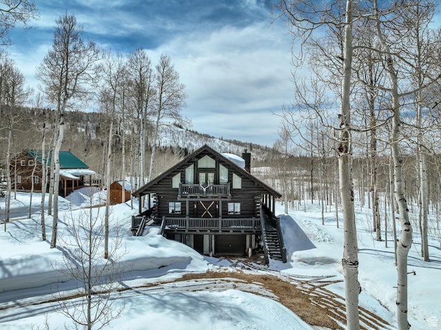 4100 Buck Way Unit 1947, Heber City, UT 84032 - snow covered property featuring a chimney, log exterior, and stairs