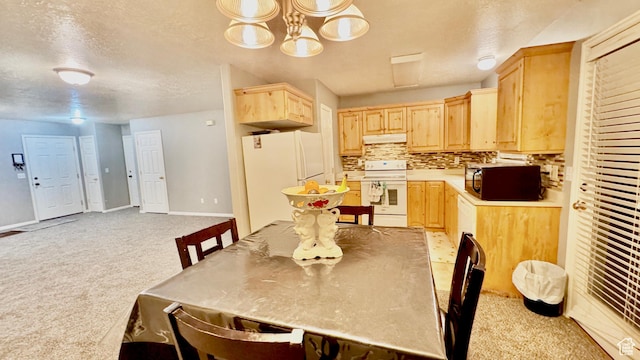 70 Teal Loop, Logan, UT 84321 - dining area with light carpet, baseboards, and a textured ceiling