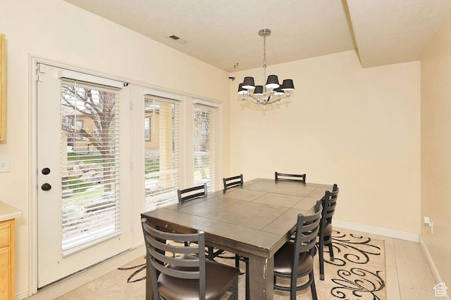 dining room featuring visible vents, baseboards, a chandelier, and light tile patterned flooring