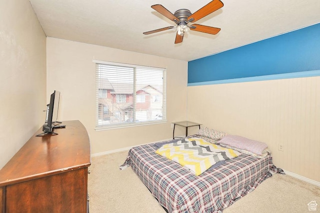 bedroom featuring baseboards, carpet flooring, and ceiling fan