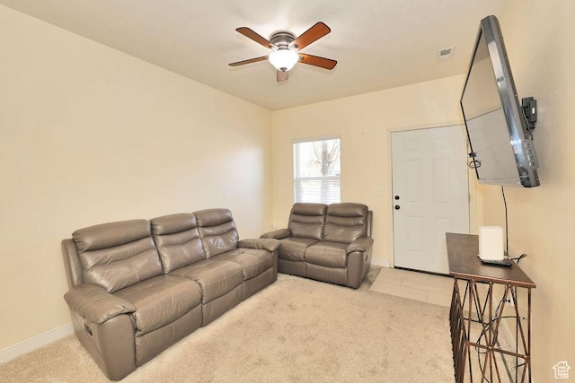 living room with baseboards, a ceiling fan, visible vents, and carpet floors
