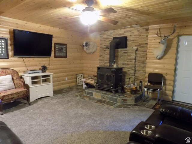 475 W 100 N, Aurora, UT 84620 - living area with a wood stove, a ceiling fan, carpet flooring, and wooden ceiling
