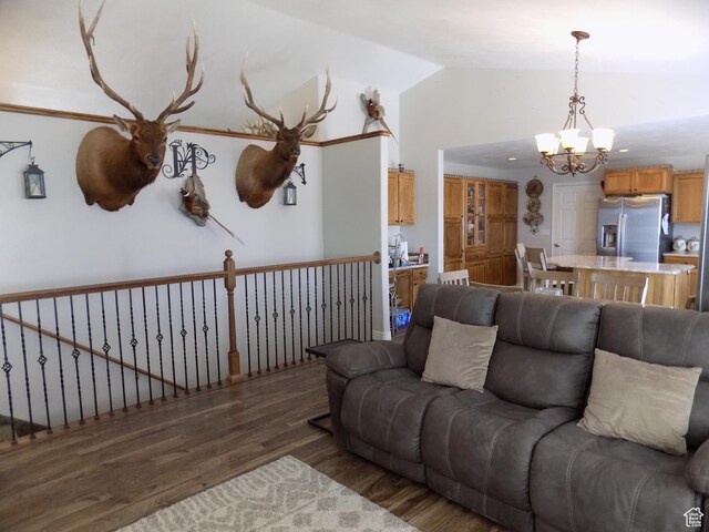 475 W 100 N, Aurora, UT 84620 - living room featuring vaulted ceiling, wood finished floors, and a notable chandelier
