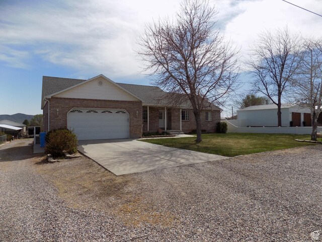 475 W 100 N, Aurora, UT 84620 - ranch-style home featuring brick siding, an attached garage, a front yard, and concrete driveway