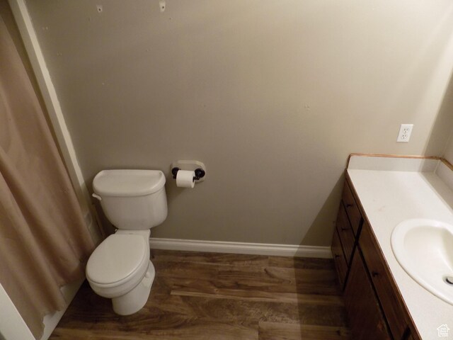 475 W 100 N, Aurora, UT 84620 - bathroom featuring toilet, baseboards, wood finished floors, and vanity