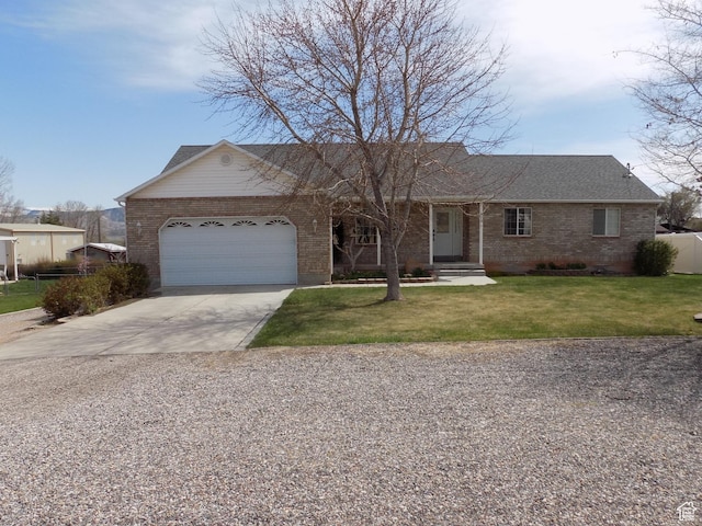 475 W 100 N, Aurora, UT 84620 - ranch-style house with brick siding, an attached garage, a front yard, and concrete driveway
