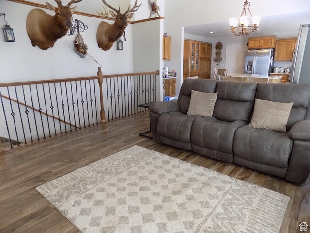 475 W 100 N, Aurora, UT 84620 - living area with a notable chandelier and wood finished floors