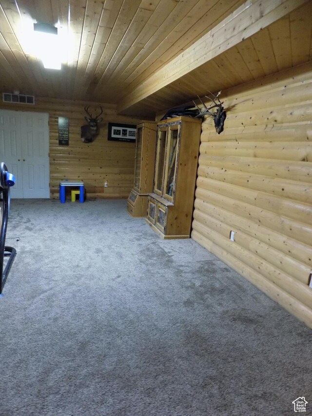 475 W 100 N, Aurora, UT 84620 - unfurnished living room featuring carpet flooring, rustic walls, visible vents, and wood ceiling