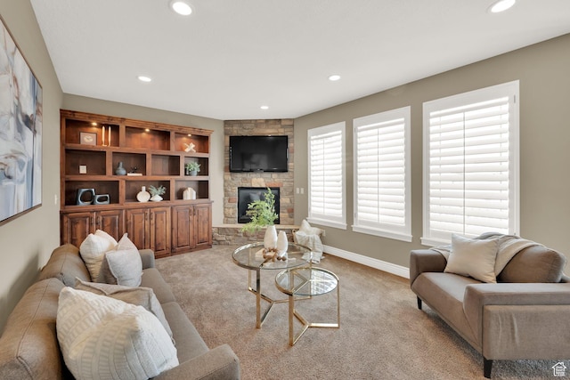 living area with baseboards, recessed lighting, carpet flooring, and a fireplace