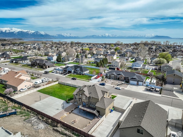 birds eye view of property featuring a mountain view and a residential view