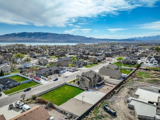bird's eye view featuring a water and mountain view and a residential view