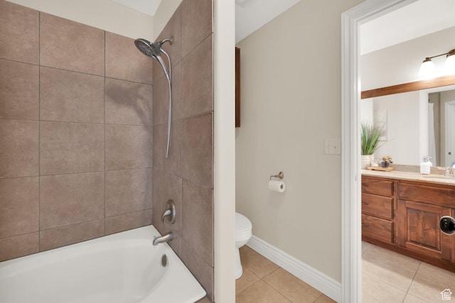 full bath featuring bathtub / shower combination, vanity, toilet, tile patterned floors, and baseboards