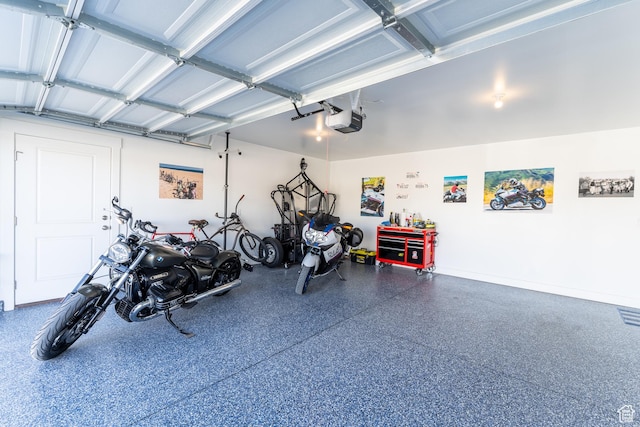 3048 S 400 W, Nibley, UT 84321 - garage featuring a garage door opener and baseboards